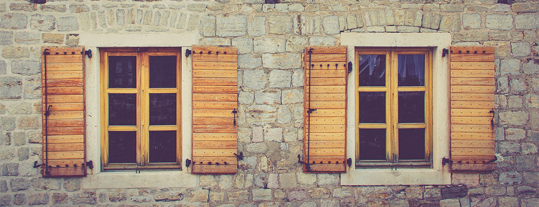 Exterior view of a brick home's windows